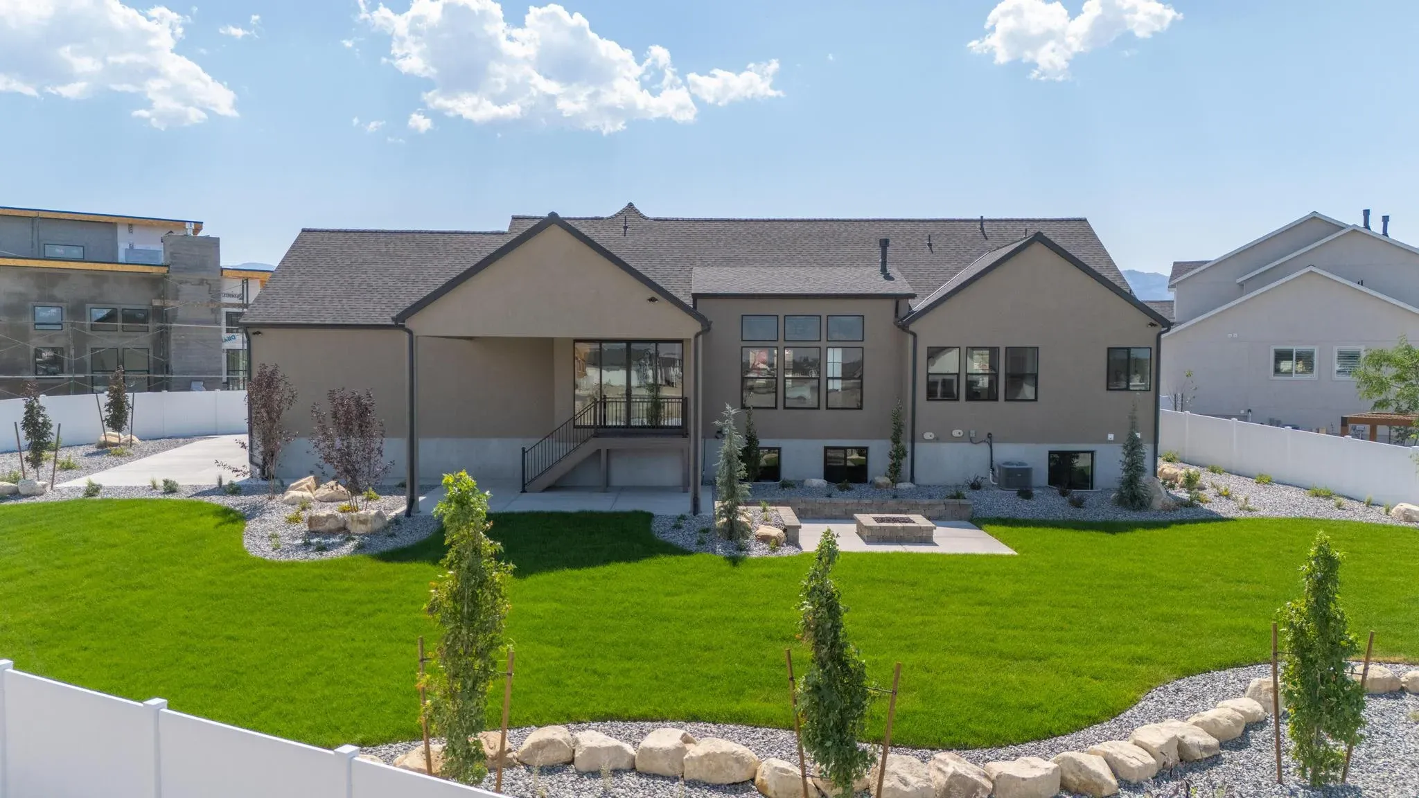 An Eagle Point Homes example with a covered patio and landscaped backyard